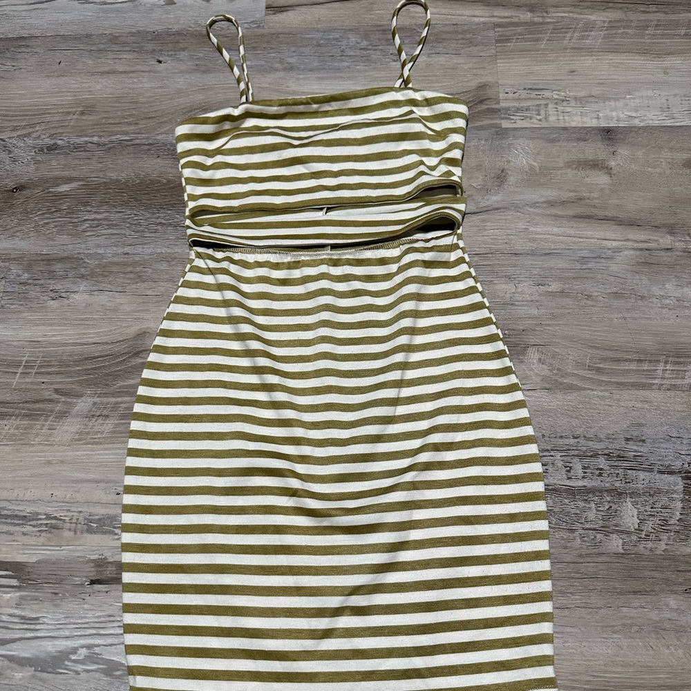 Stripped spaghetti strapped dress. With opening under breasts.